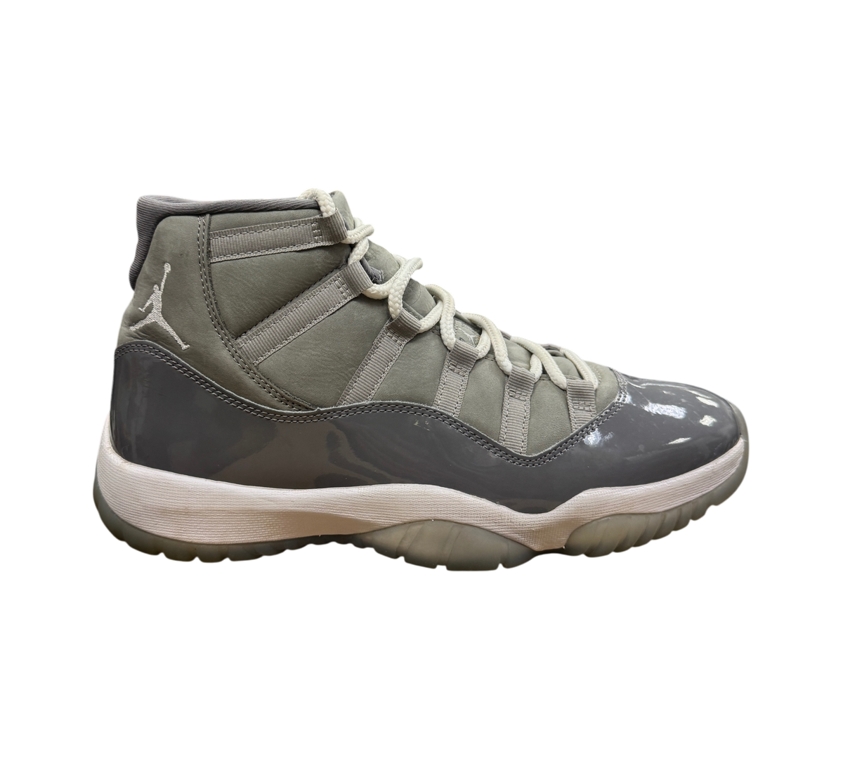 Genesis Boutique Jordan 11 Cool Grey sneakers featuring grey nubuck and patent leather with white laces and midsole