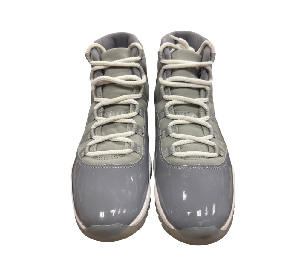 Genesis Boutique Jordan 11 Cool Grey sneakers featuring grey patent leather and nubuck with white laces
