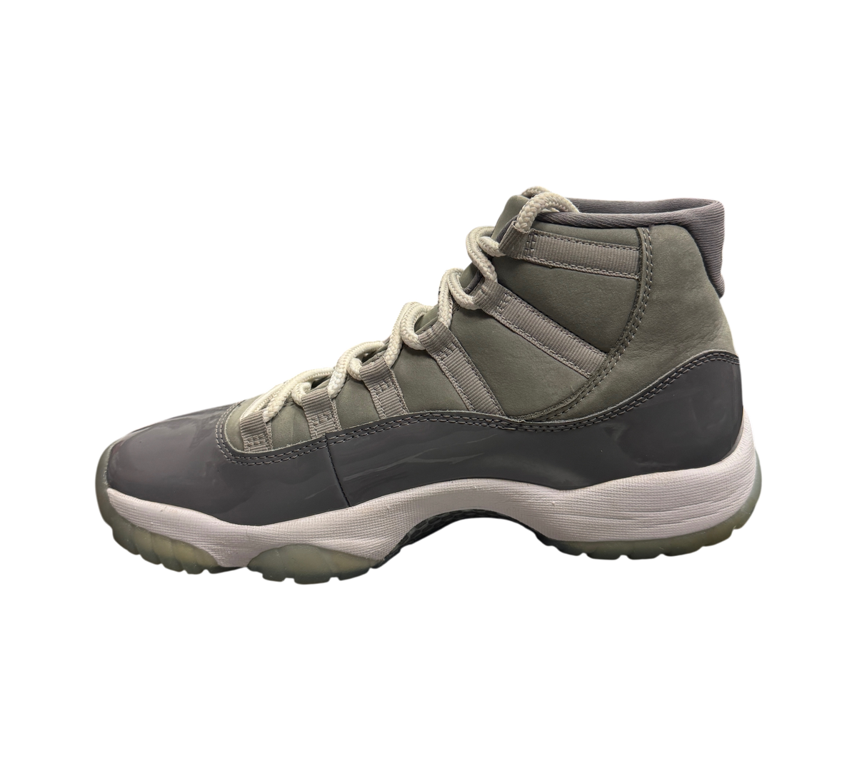 Genesis Boutique Jordan 11 Cool Grey sneakers featuring a grey patent leather mudguard and matching nubuck upper.