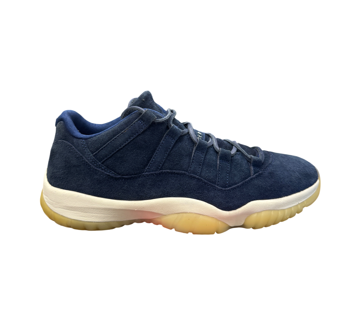 Genesis Boutique Jordan 11 Derek Jeter RE2PECT sneakers in navy blue suede with a cream midsole and gum outsole.