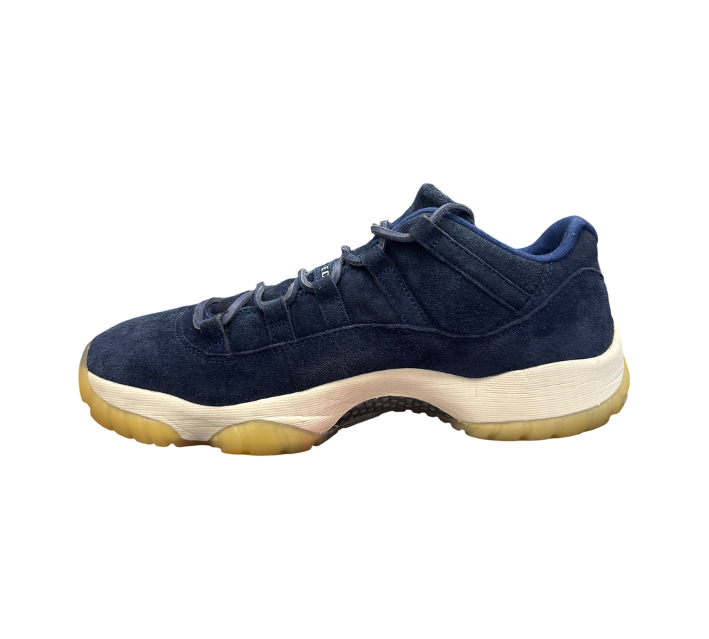 Genesis Boutique Jordan 11 Derek Jeter RE2PECT sneakers in navy blue suede with a white midsole and gum outsole.