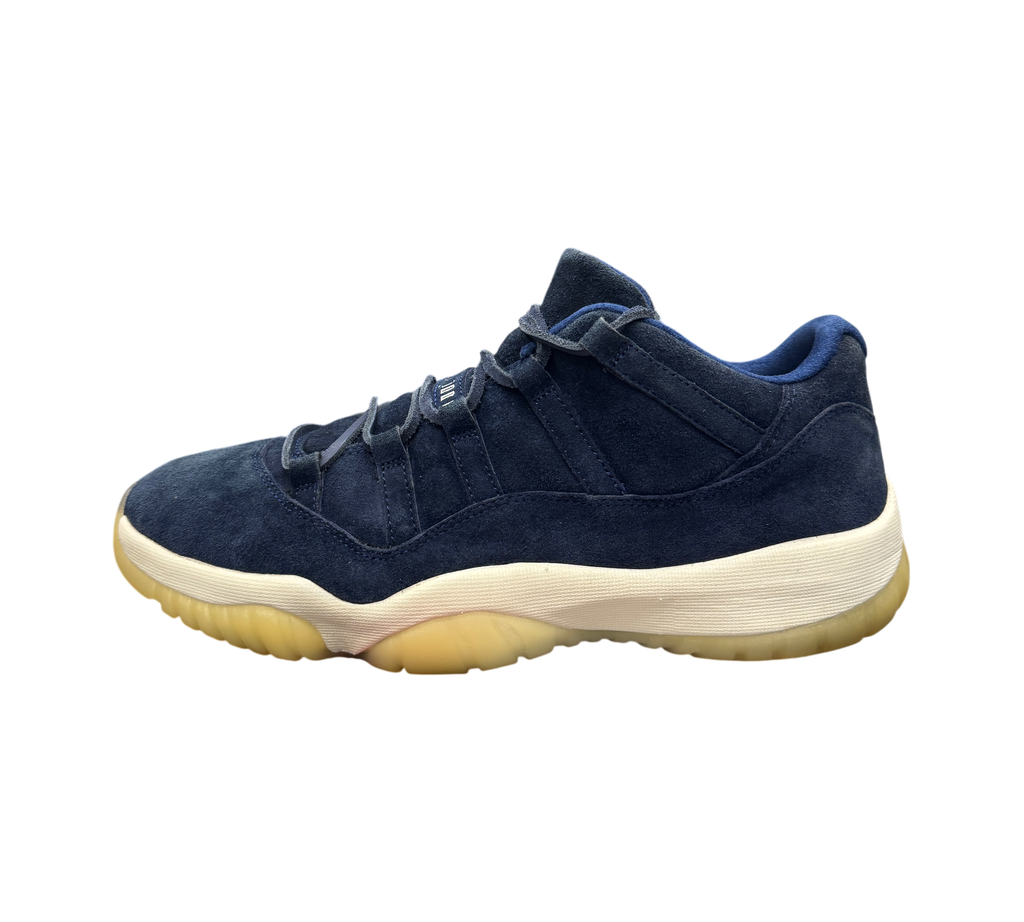 Genesis Boutique Jordan 11 Derek Jeter RE2PECT sneakers in navy blue suede with a white midsole and gum outsole.