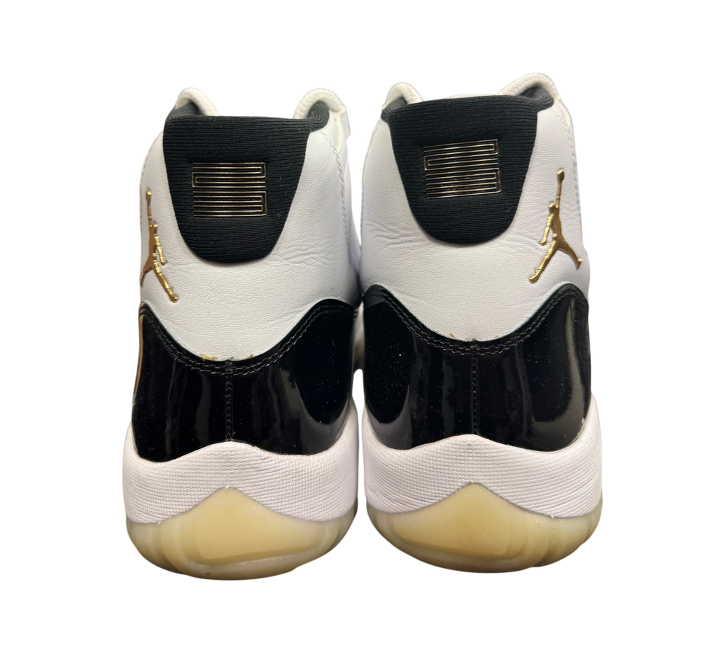 Genesis Boutique Jordan 11 DMP Gratitude sneakers featuring white leather, black patent leather, and gold accents