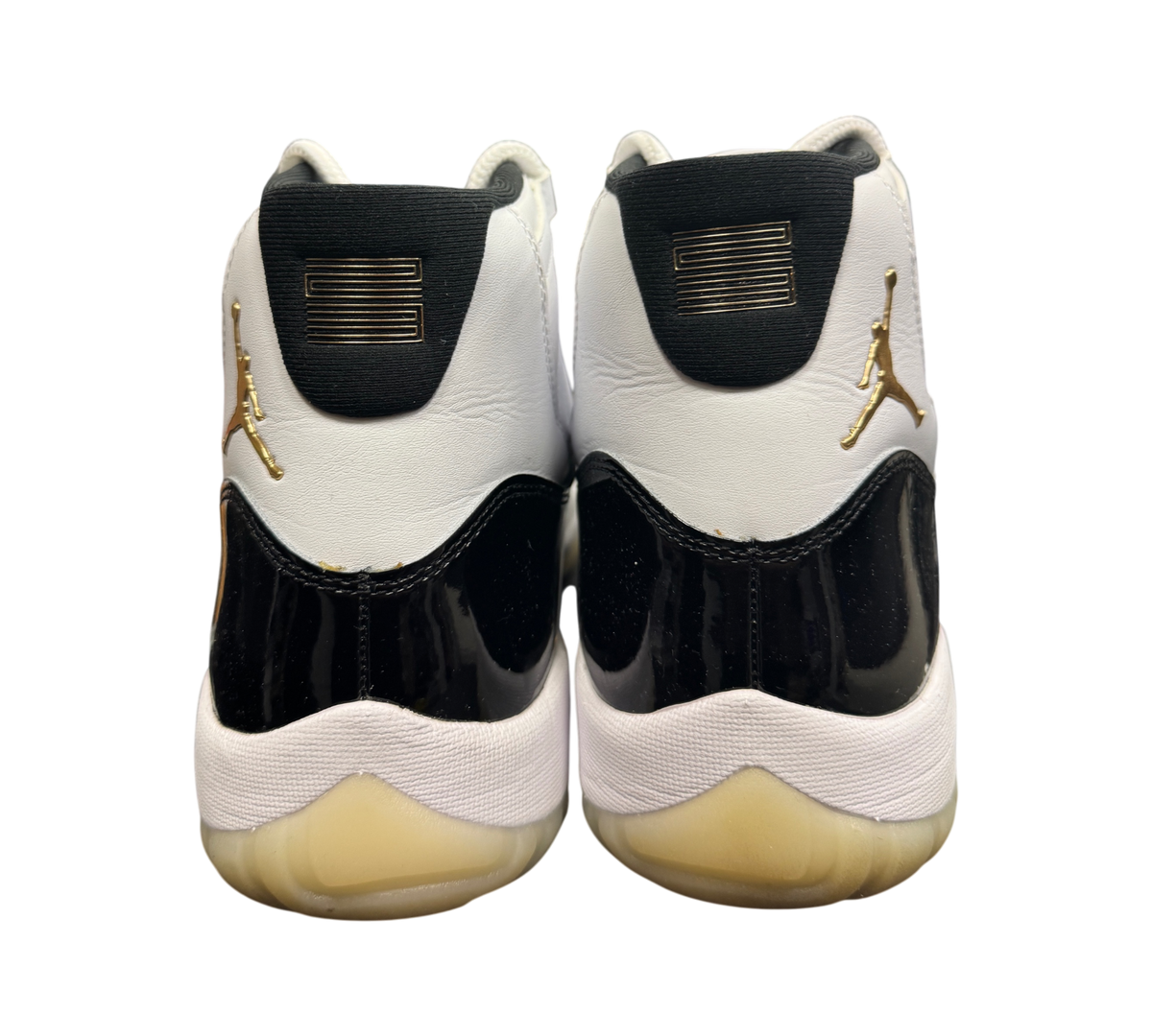 Genesis Boutique Jordan 11 DMP Gratitude sneakers featuring white leather, black patent leather, and gold accents