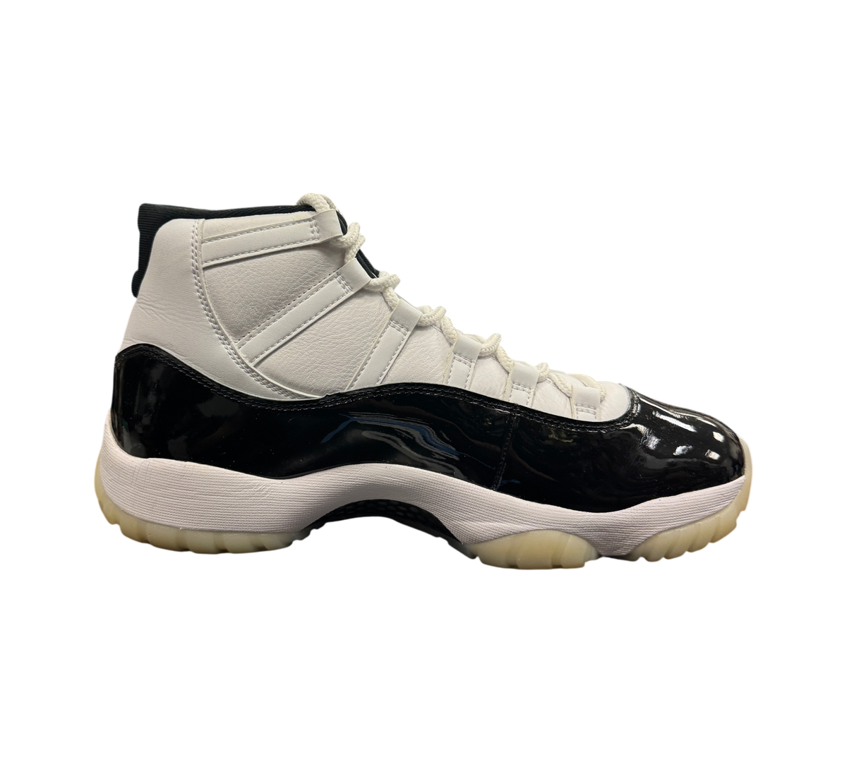Genesis Boutique Jordan 11 DMP Gratitude sneaker in white leather and black patent leather with a translucent outsole