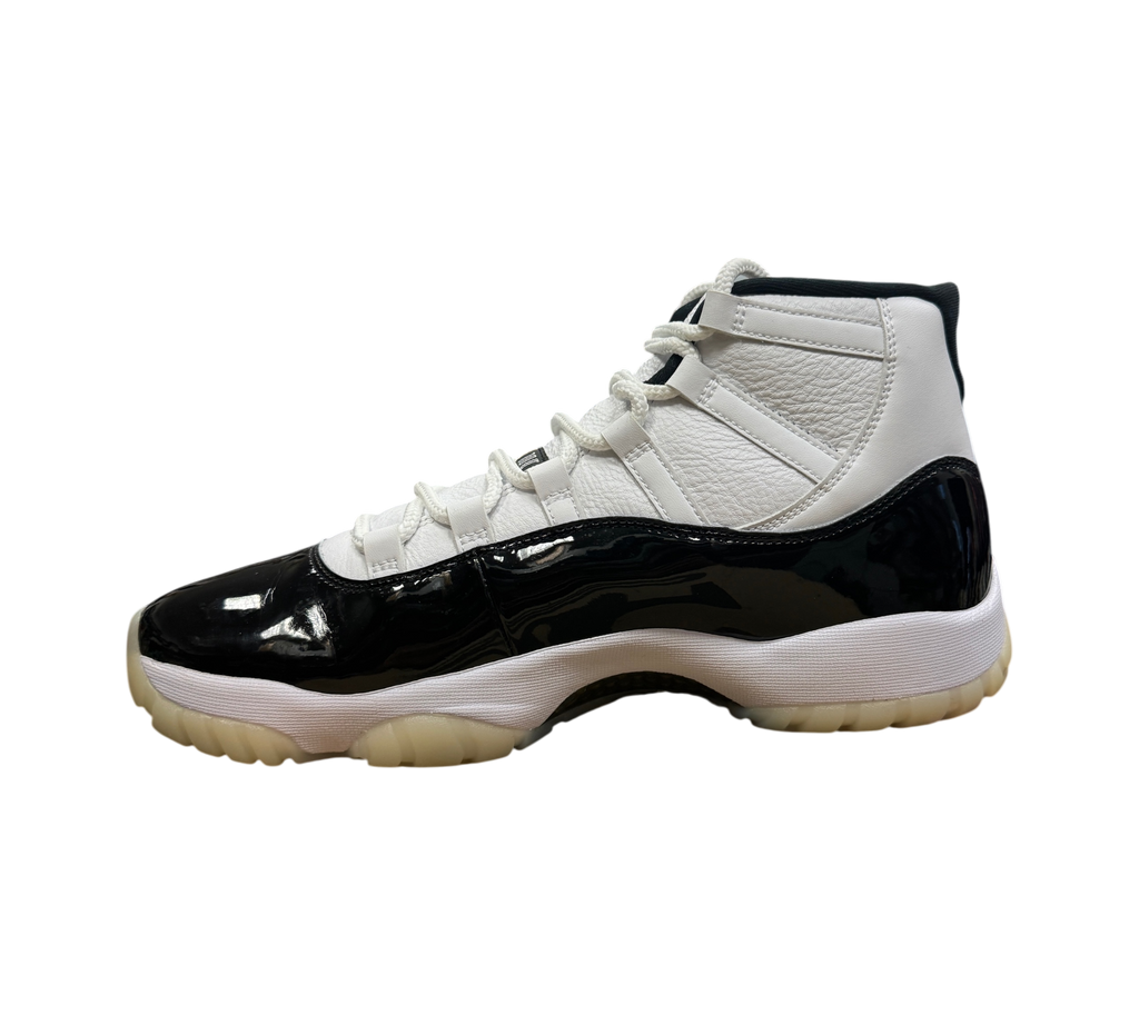 Genesis Boutique Jordan 11 DMP Gratitude sneakers featuring white leather upper and black patent leather mudguard