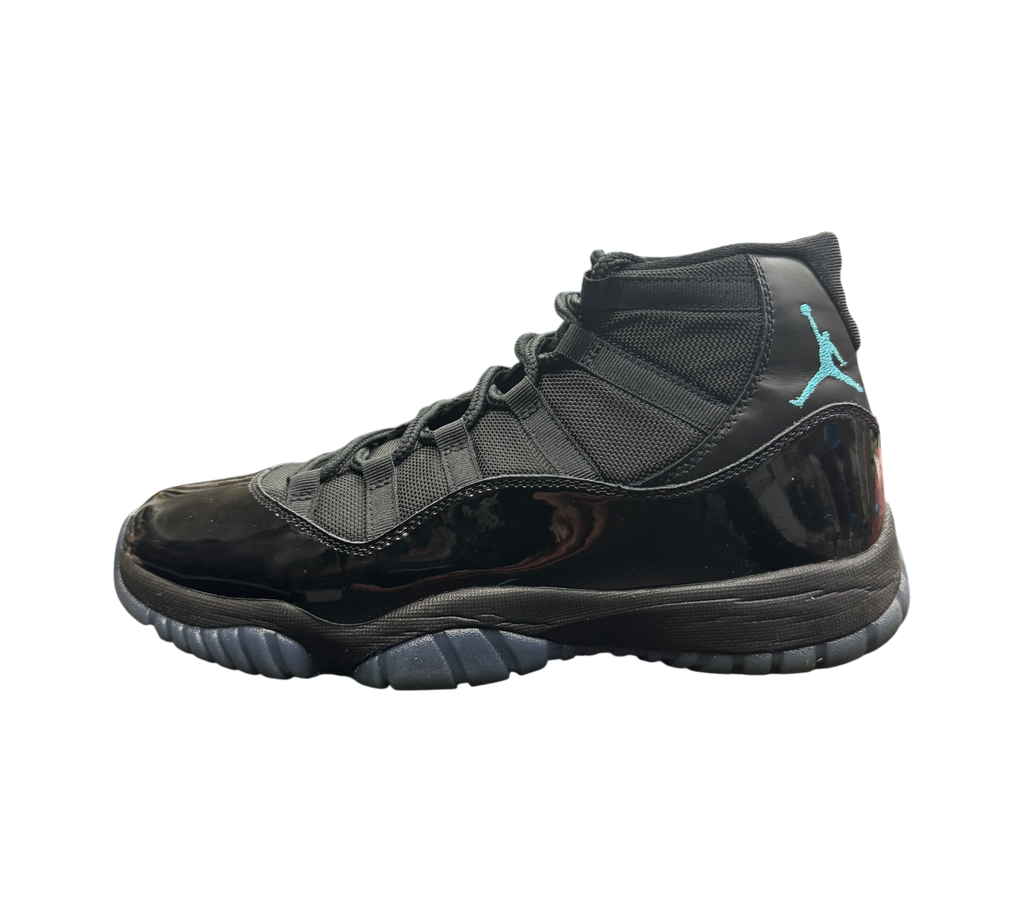 Genesis Boutique Jordan 11 Gamma sneakers in black with patent leather and blue Jumpman logo on a display box
