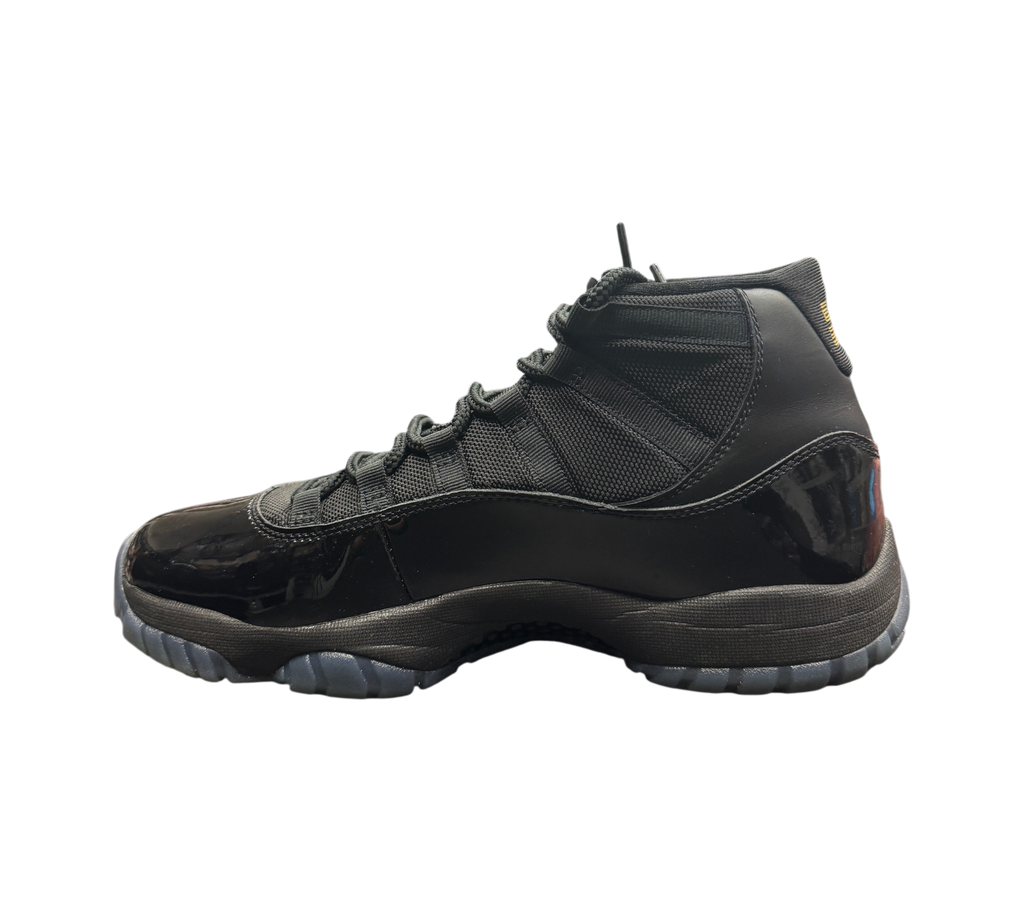 Genesis Boutique Jordan 11 Gamma sneakers in black with patent leather mudguard and translucent blue-tinted outsole
