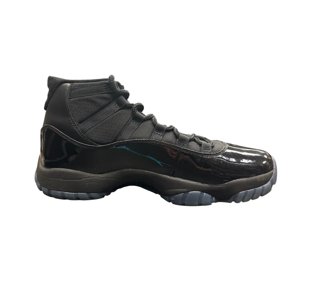 Genesis Boutique Jordan 11 Gamma sneakers in black with patent leather and signature blue Jumpman logo on a shoe box