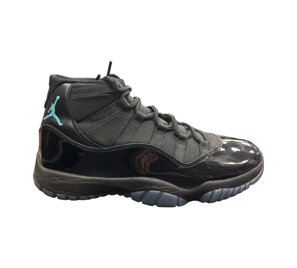 Genesis Boutique Jordan 11 Gamma sneakers in black with patent leather and blue Jumpman logo on a display box
