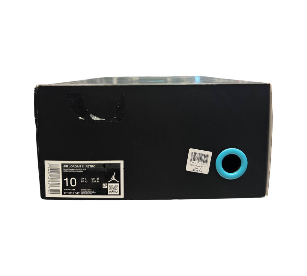 Genesis Boutique Jordan 11 Gamma sneaker box with size 10 label and retail price tag in a retail store setting