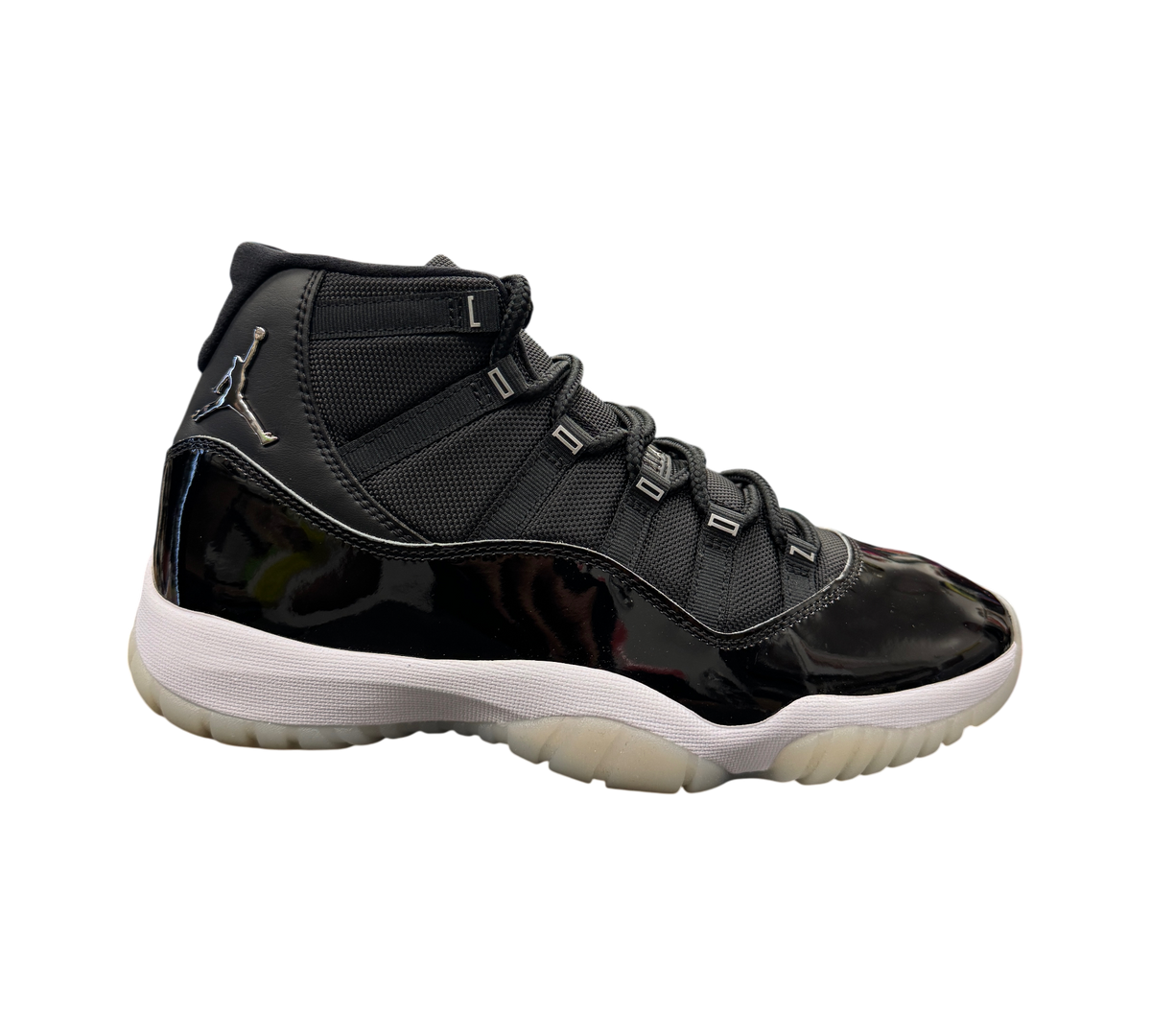 Genesis Boutique Jordan 11 Jubilee sneaker in black with patent leather mudguard and metallic silver Jumpman logo