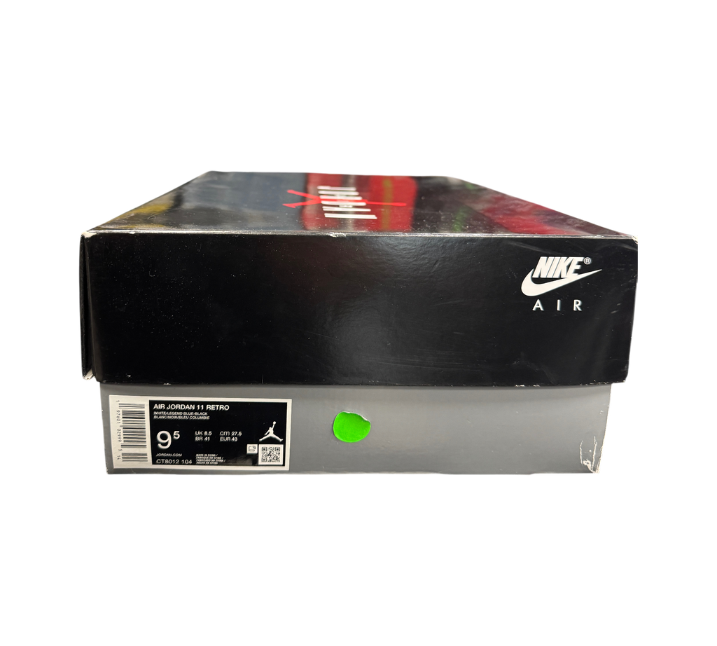 Genesis Boutique Jordan 11 Legend Blue sneaker box with Nike Air branding and size label in a retail store setting