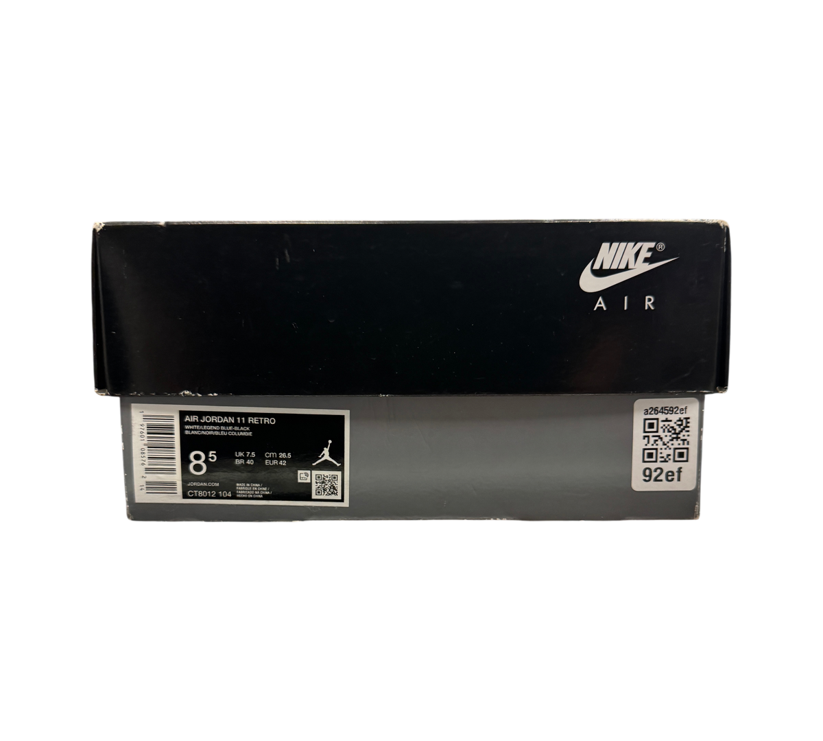 Genesis Boutique Jordan 11 Legend Blue sneaker box with Nike Air branding and size label on a glass display counter
