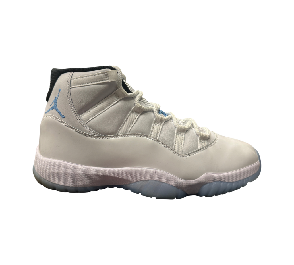 Genesis Boutique Jordan 11 Legend Blue sneakers in white leather with light blue accents and translucent outsole