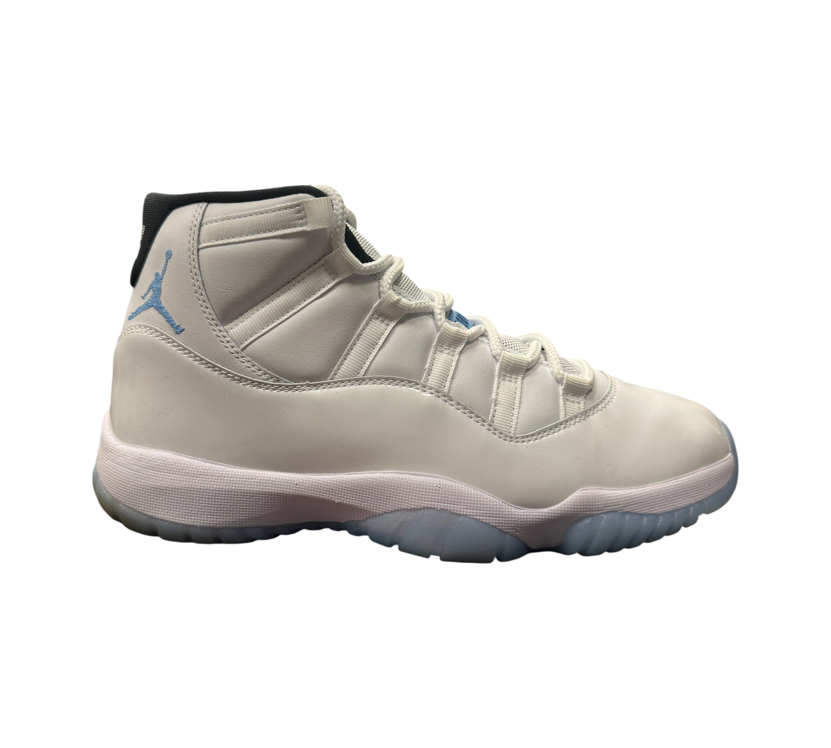 Genesis Boutique Jordan 11 Legend Blue sneakers in white leather with light blue accents and translucent outsole