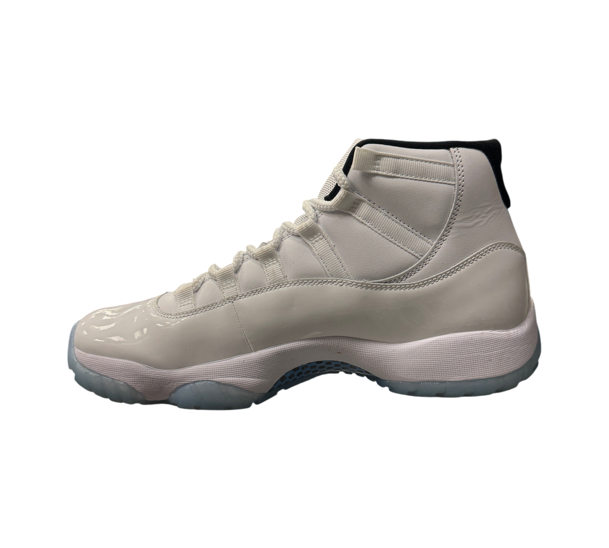 Genesis Boutique Jordan 11 Legend Blue sneakers in white leather with patent leather mudguard and translucent blue sole