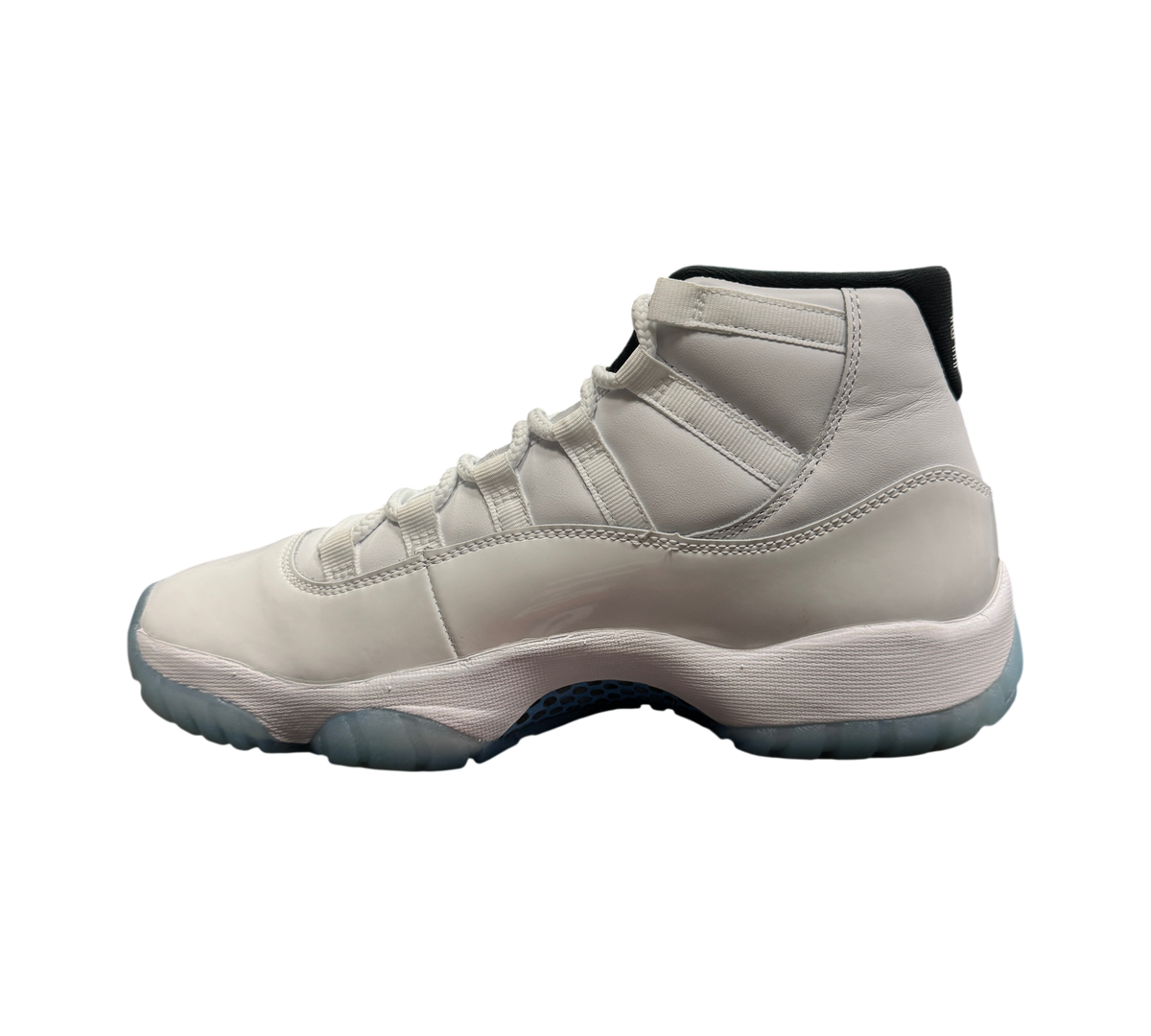 Genesis Boutique Jordan 11 Legend Blue sneaker in white leather and patent leather with icy blue outsole