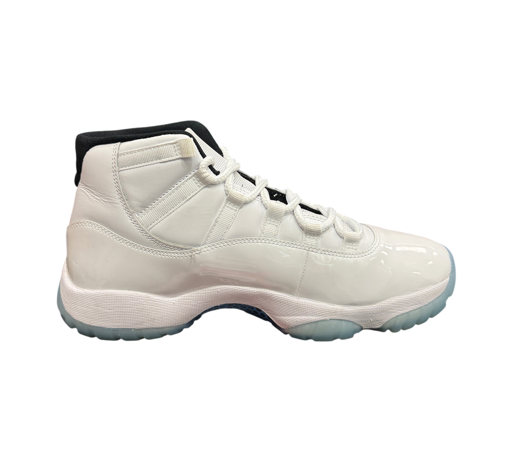 Genesis Boutique Jordan 11 Legend Blue sneaker in white patent leather with black collar and icy blue translucent sole