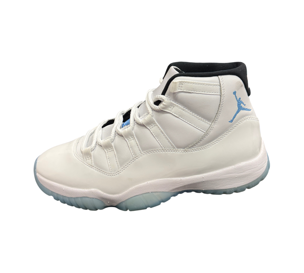 Genesis Boutique Jordan 11 Legend Blue sneaker in white leather with light blue Jumpman logo on a black shoe box