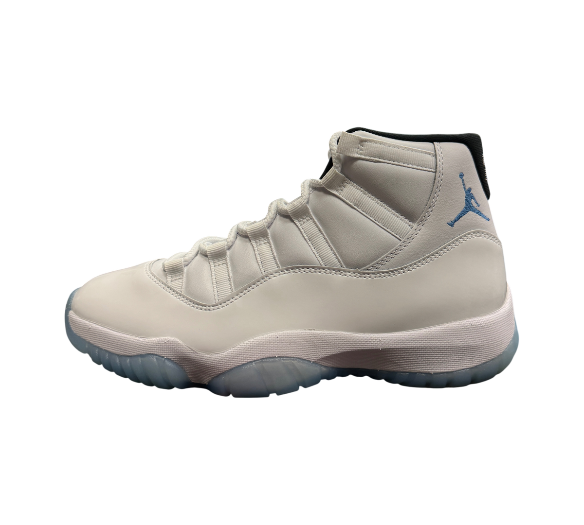 Genesis Boutique Jordan 11 Legend Blue sneaker in white leather with light blue accents and translucent sole