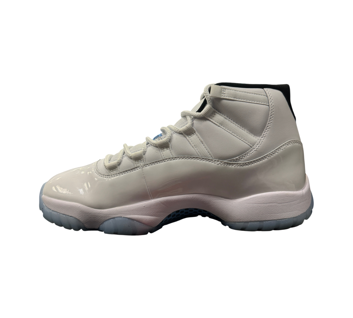 Genesis Boutique Jordan 11 Legend Blue sneakers in white patent leather with light blue translucent sole