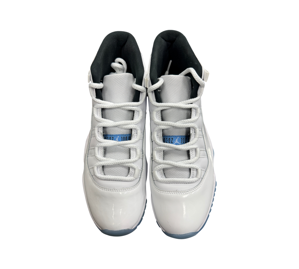 Genesis Boutique Jordan 11 Legend Blue sneakers in white patent leather with light blue accents and black lining