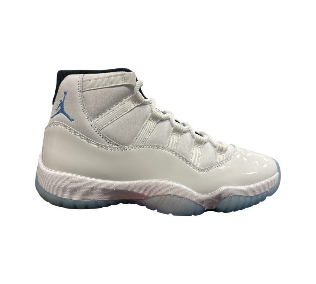 Genesis Boutique Jordan 11 Legend Blue sneakers in white patent leather with light blue Jumpman logo on a shoe box