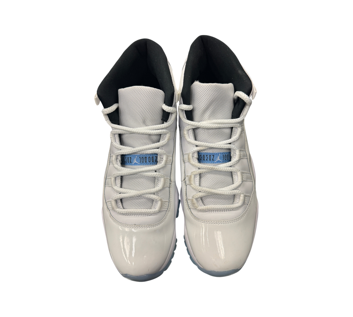 Genesis Boutique Jordan 11 Legend Blue sneakers in white patent leather with light blue accents and black lining