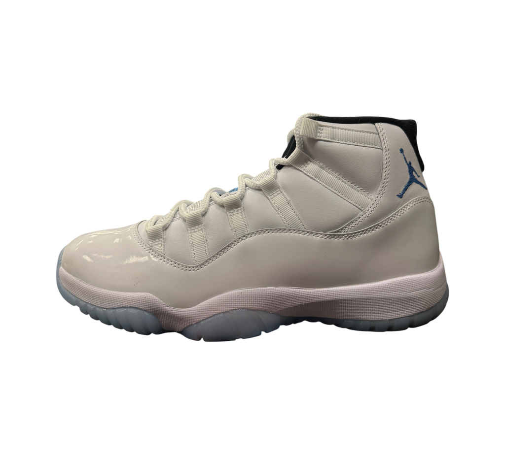 Genesis Boutique Jordan 11 Legend Blue sneaker in white patent leather with light blue Jumpman logo and icy blue sole