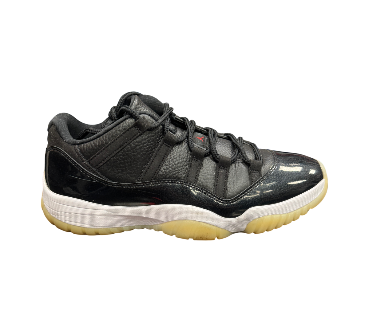 Genesis Boutique Jordan 11 Low 72-10 sneakers in black leather and patent leather with a white midsole and gum outsole