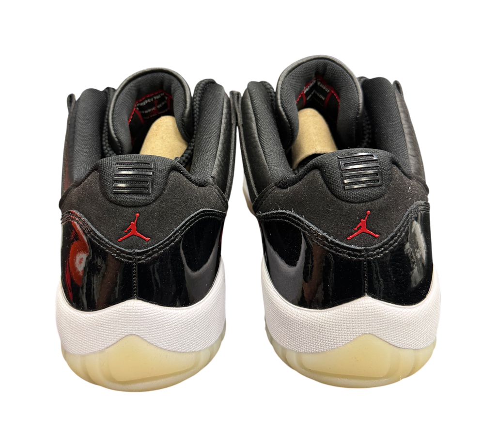 Genesis Boutique Jordan 11 Low 72-10 sneakers in black patent leather with red Jumpman logo, rear view