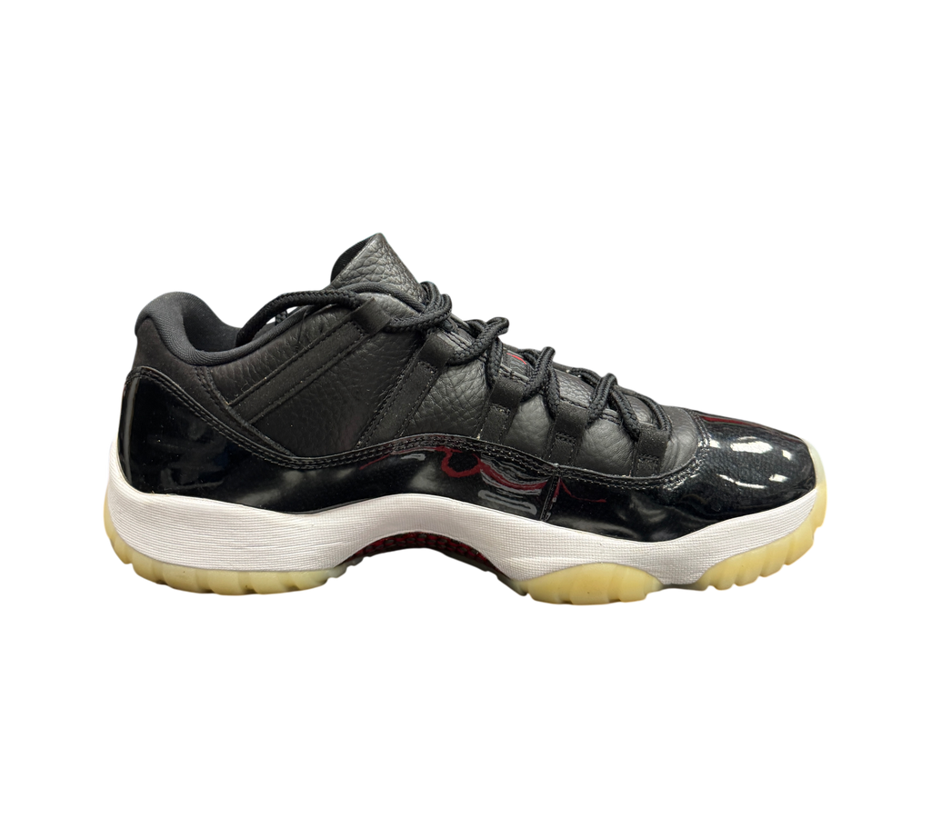 Genesis Boutique Jordan 11 Low 72-10 sneakers in black leather and patent leather with a white midsole and gum outsole