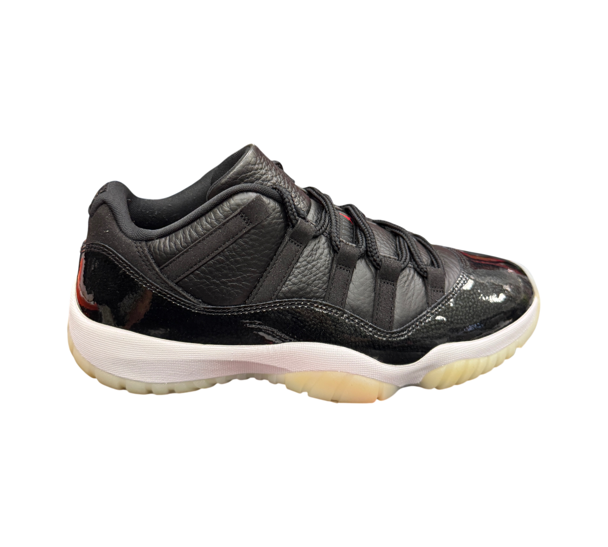 Genesis Boutique Jordan 11 Low 72-10 sneakers in black leather and patent leather with a white midsole