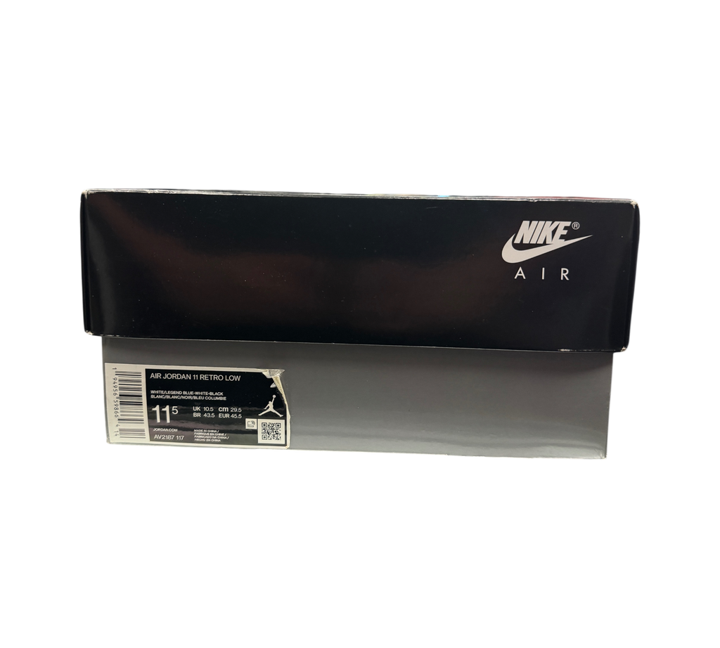Genesis Boutique Jordan 11 Low Legend Blue sneaker box with Nike Air branding on a black and grey retail display