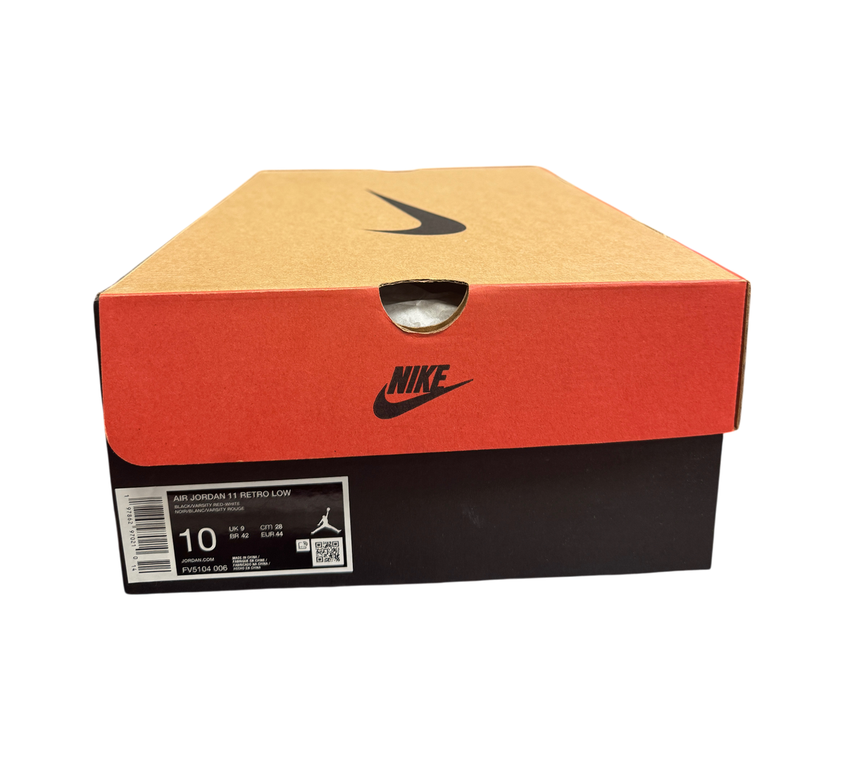 Genesis Boutique Jordan 11 Low Bred sneaker box with Nike branding and size 10 label in a retail store setting.