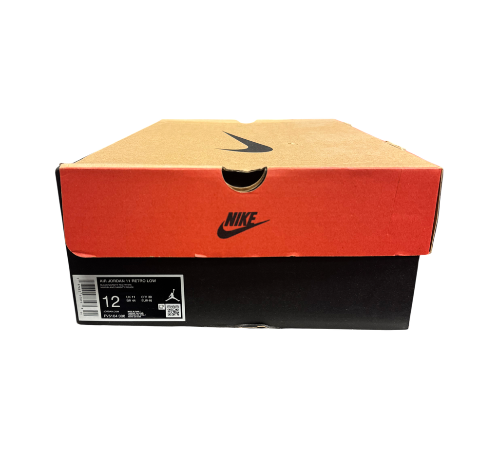 Genesis Boutique Jordan 11 Low Bred sneaker box with size 12 label and Nike branding in a retail store display