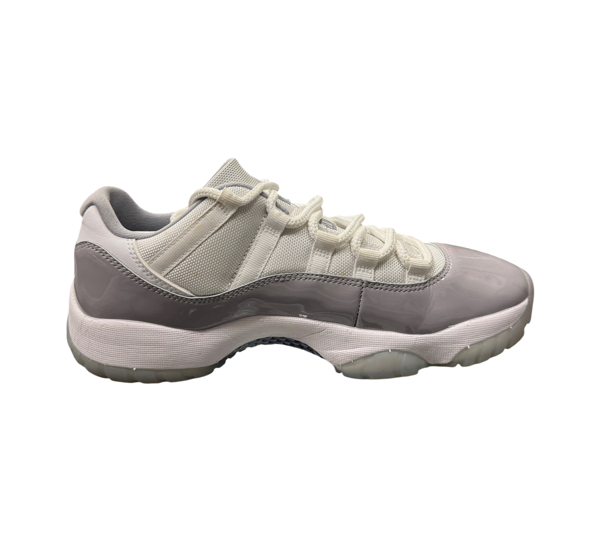 Genesis Boutique pre-owned Jordan 11 Low Cement Grey sneakers featuring white mesh and grey patent leather overlays.