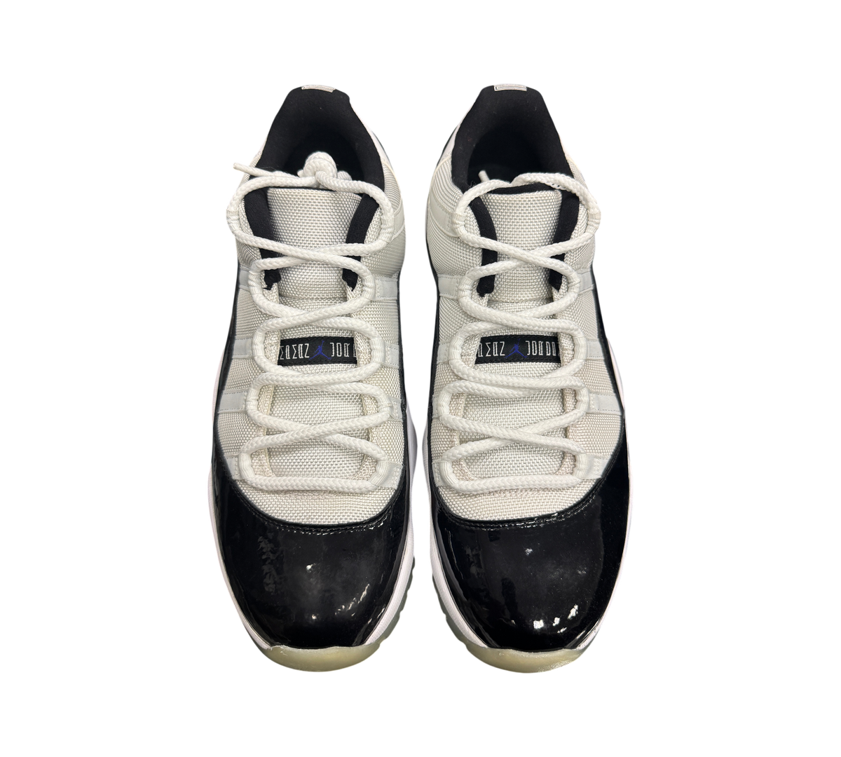 Genesis Boutique pre-owned Jordan 11 Low Concord sneakers featuring white mesh uppers and black patent leather mudguards
