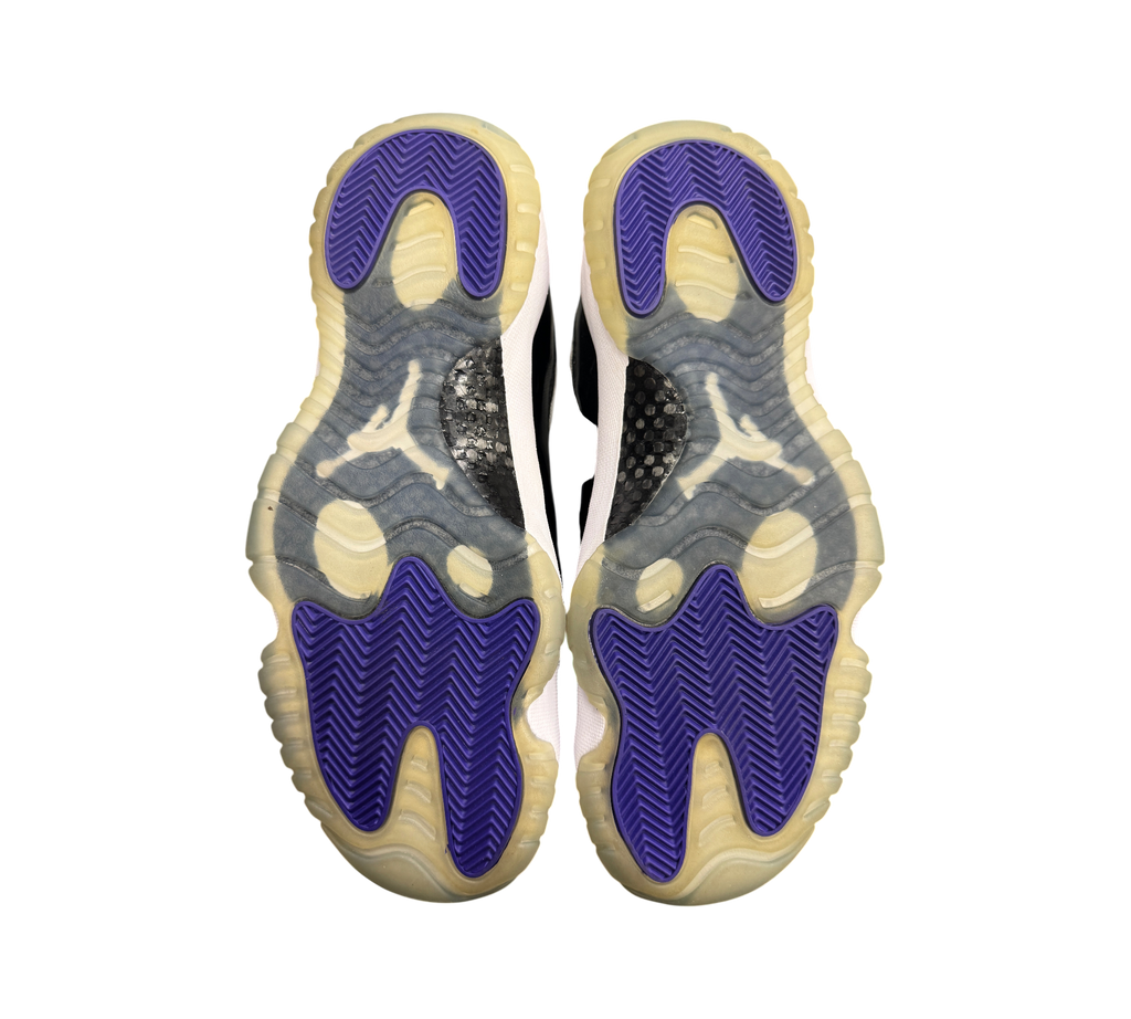 Genesis Boutique used Jordan 11 Low Concord sneakers showing purple and translucent outsoles with carbon fiber plates