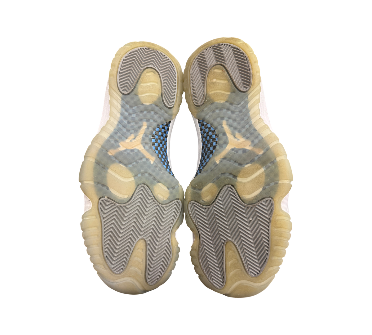 Genesis Boutique used Jordan 11 Low Grey Cement sneakers showing the translucent outsoles and carbon fiber plates