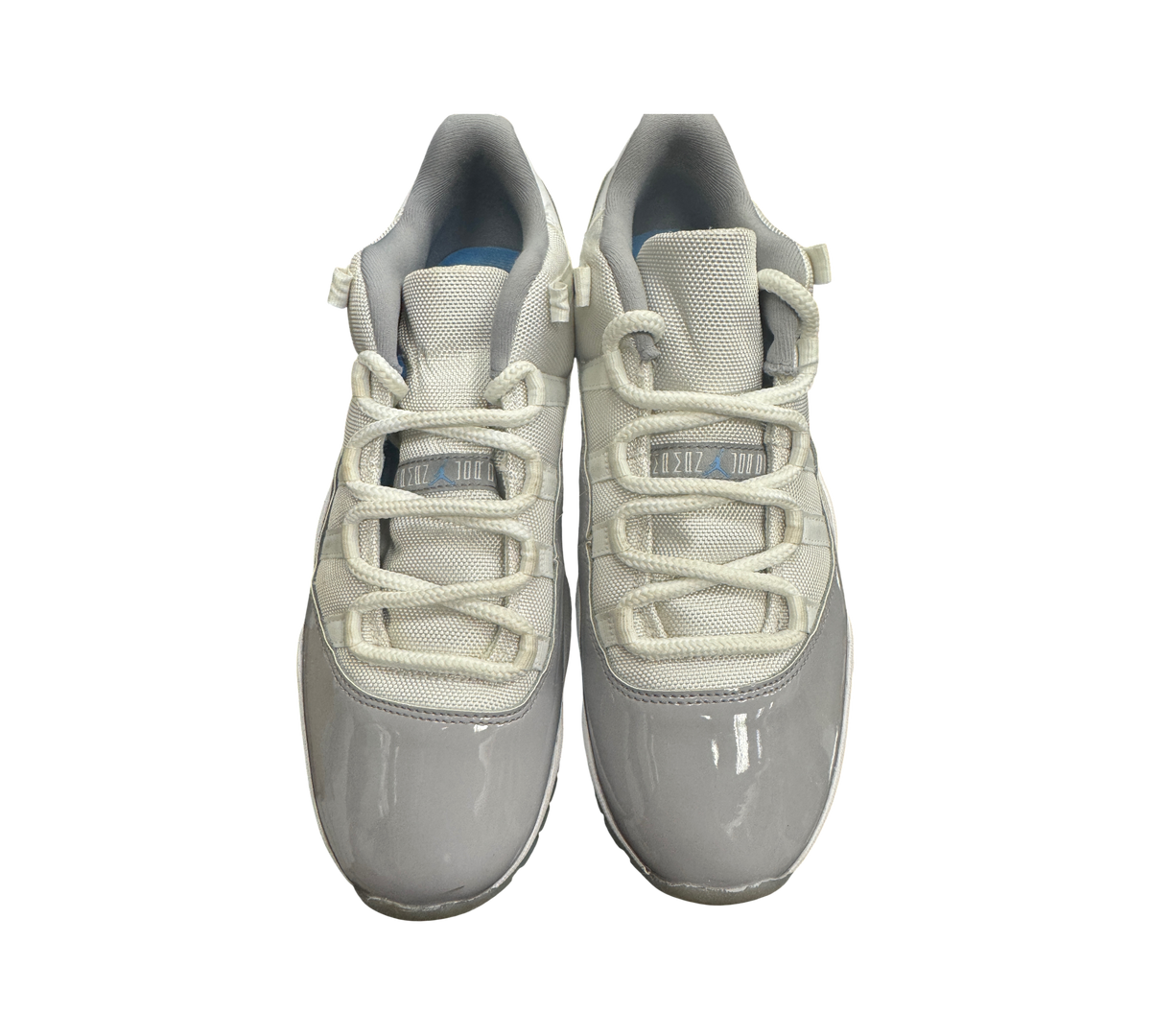 Genesis Boutique pre-owned Jordan 11 Low Grey Cement sneakers with white mesh upper and grey patent leather mudguard.