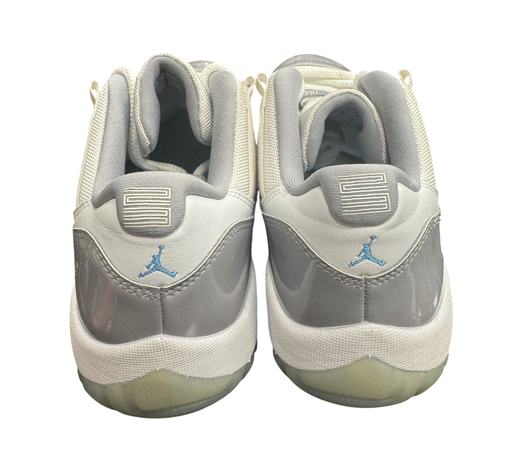 Genesis Boutique pre-owned Jordan 11 Low Grey Cement sneakers featuring grey patent leather and light blue Jumpman logo