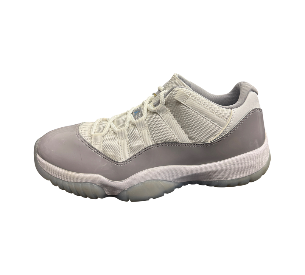 Genesis Boutique pre-owned Jordan 11 Low Grey Cement sneakers featuring white mesh and grey patent leather overlays.