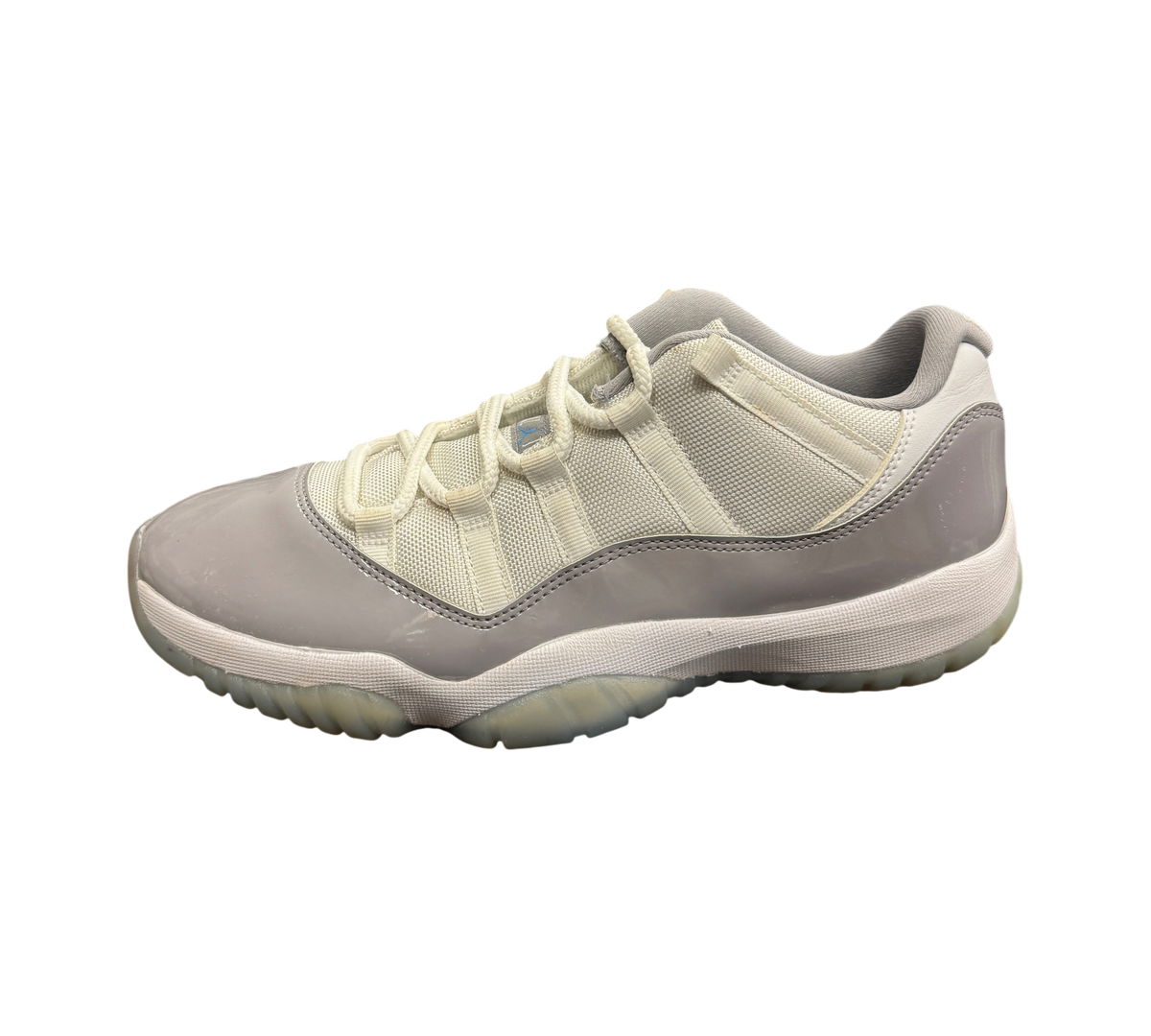 Genesis Boutique pre-owned Jordan 11 Low Grey Cement sneakers featuring grey patent leather and white mesh upper.