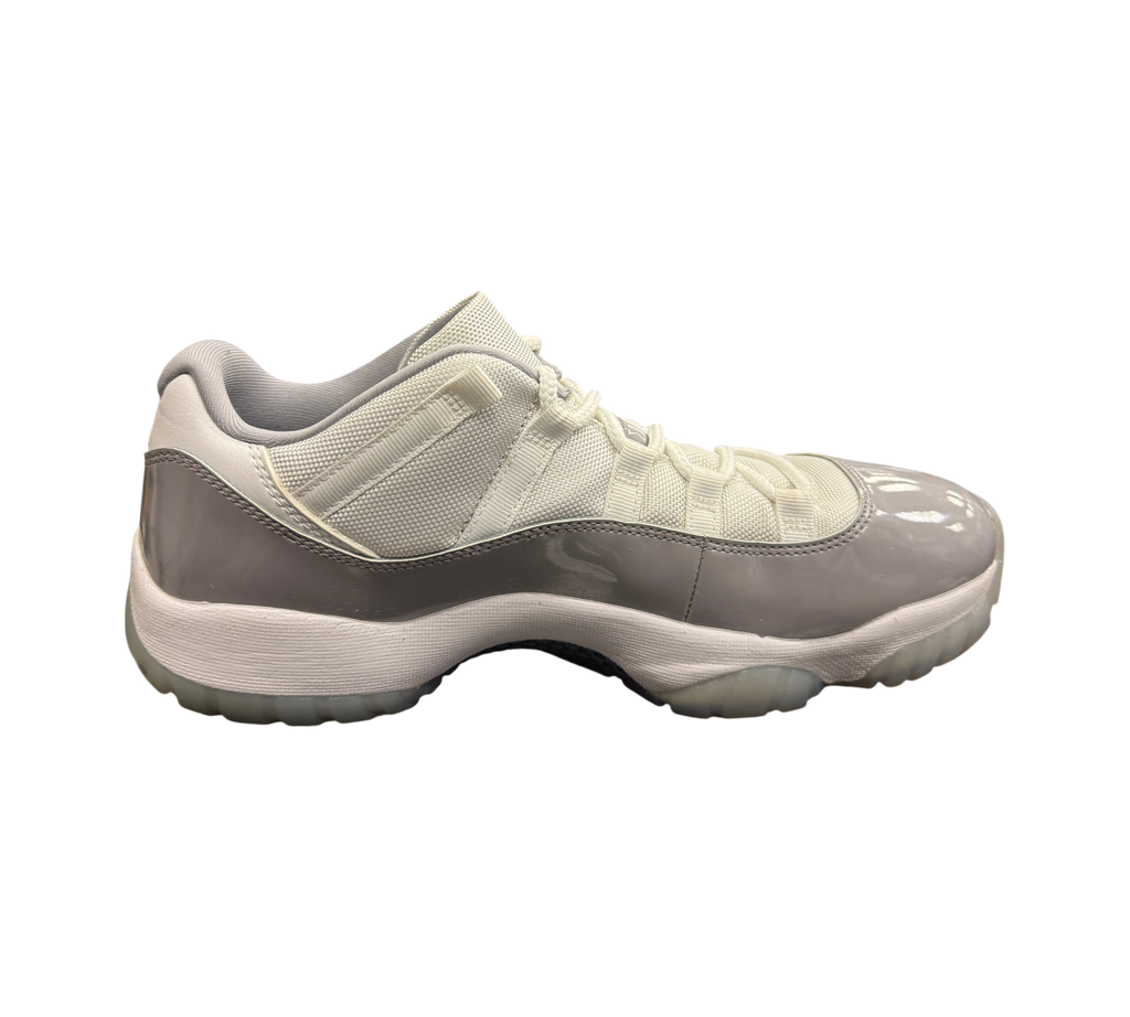 Genesis Boutique used Jordan 11 Low Grey Cement sneakers with white mesh upper and grey patent leather mudguard.