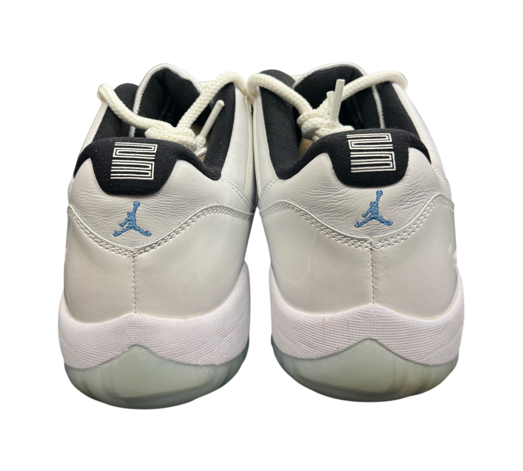 Genesis Boutique Jordan 11 Low Legend Blue sneakers showing white leather heels with blue Jumpman logos and 23 branding