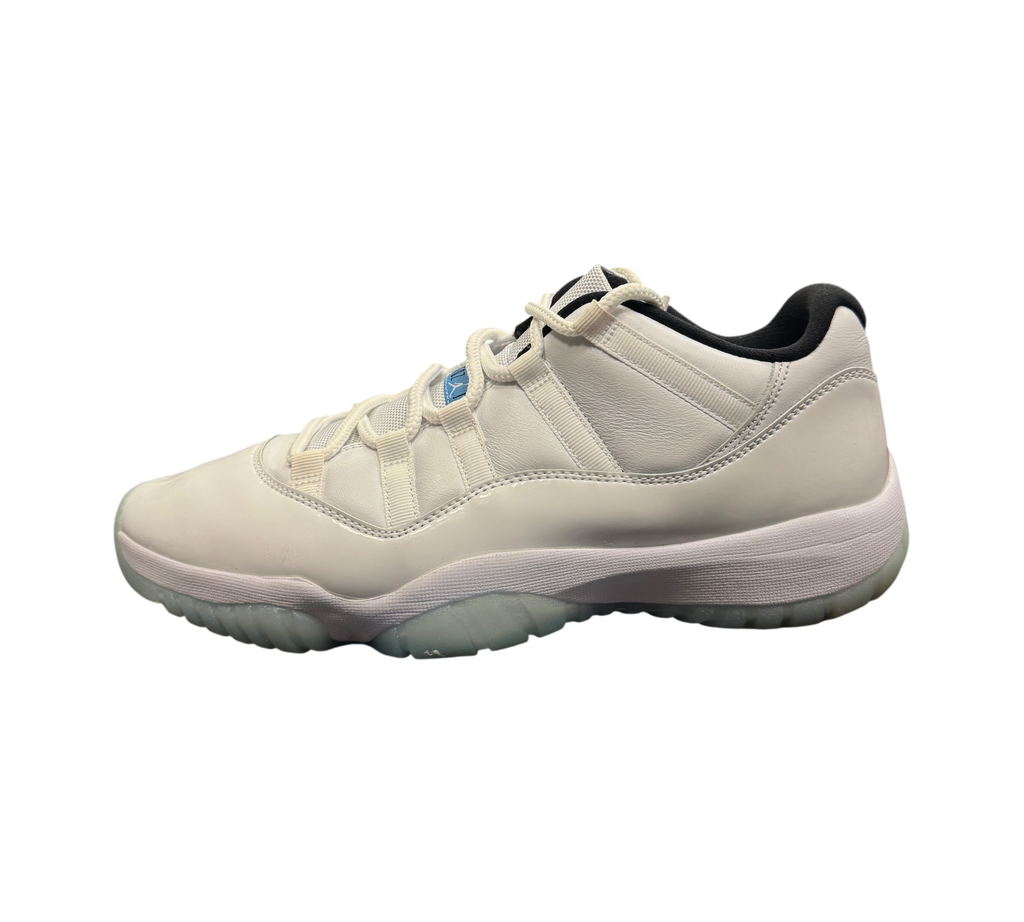 Genesis Boutique Jordan 11 Low Legend Blue sneakers in white leather with light blue accents on a black shoebox
