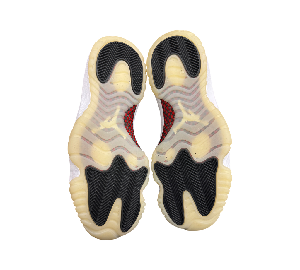 Genesis Boutique Jordan 11 Low 72-10 sneakers showing the black and translucent yellowed rubber outsoles