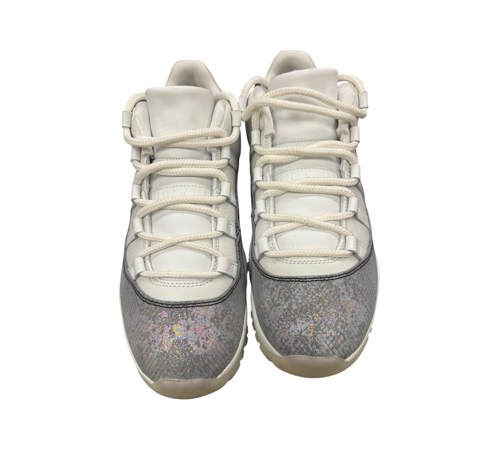 Genesis Boutique Jordan 11 Low Year of the Snake sneakers featuring white leather uppers and iridescent snake-print mudguards
